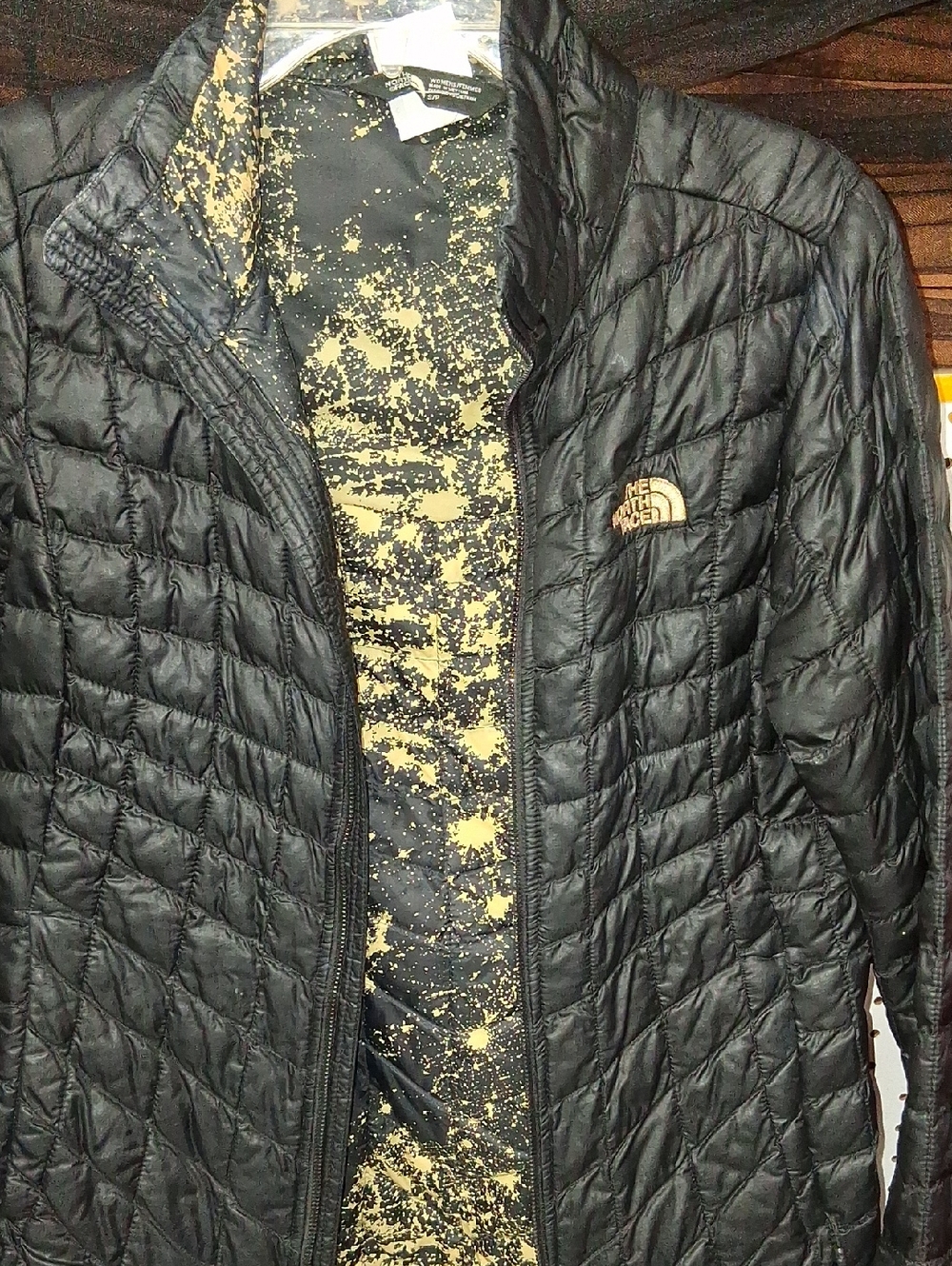 The North Face Women's Black Quilted Puffer Jacket with Gold Logo